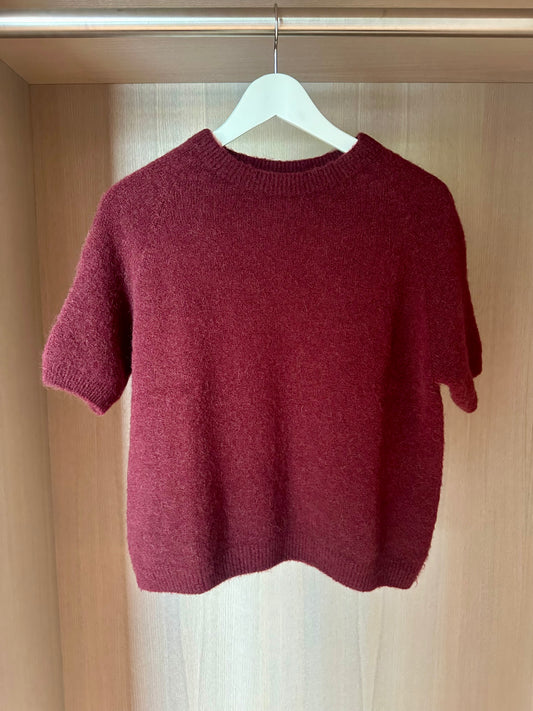 red knitted jumper
